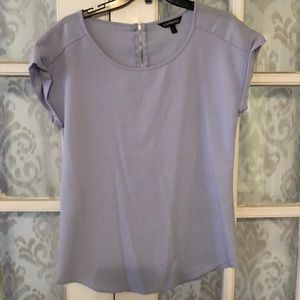 Light purple top with cap sleeve.